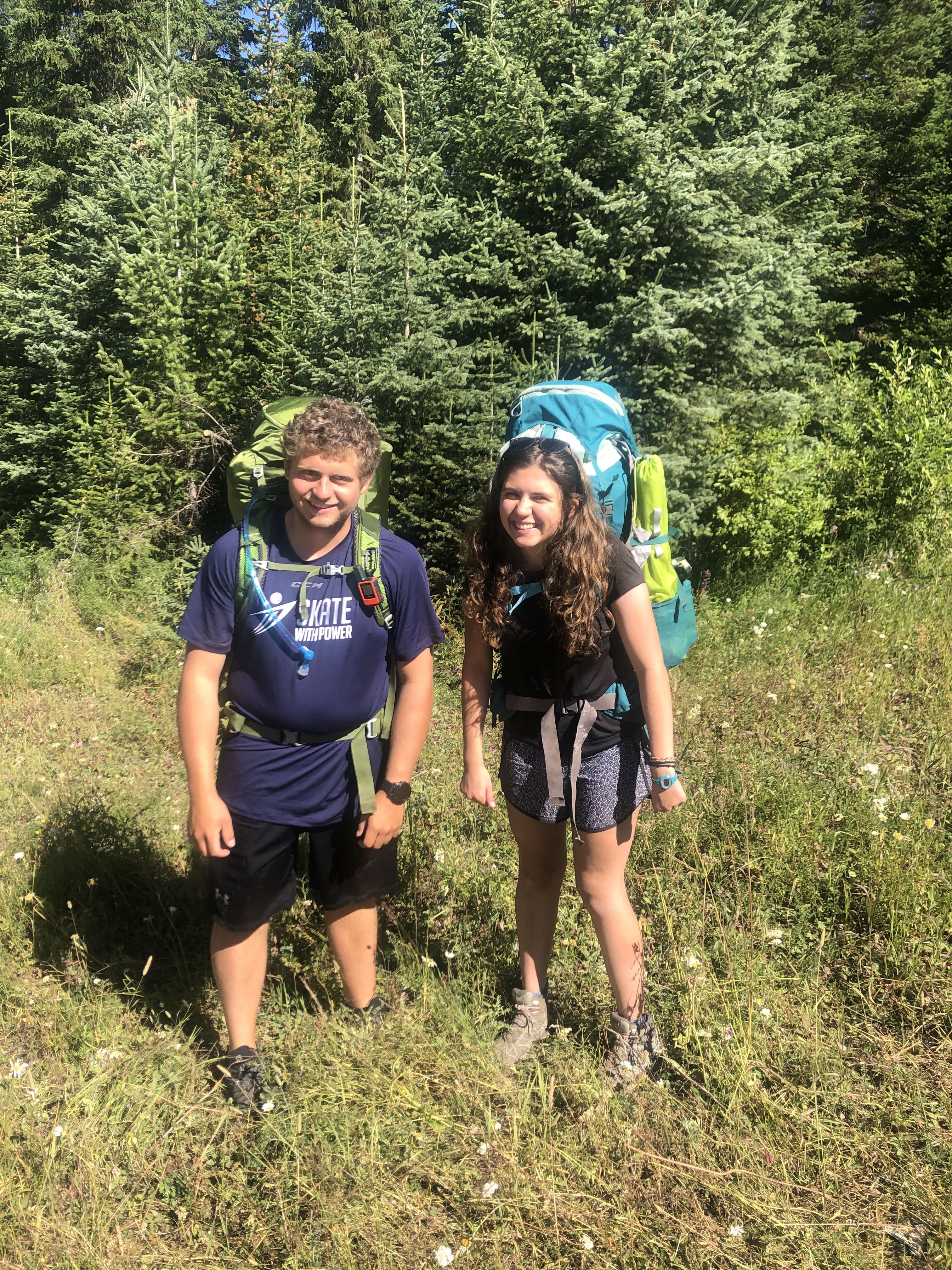 two people against a wilderness background